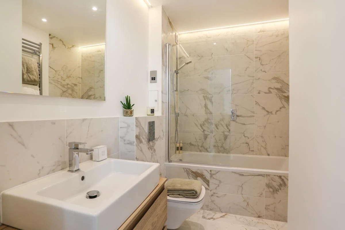 Premium tiled bathroom renovation in a Battersea Victorian terrace by AXE Construction