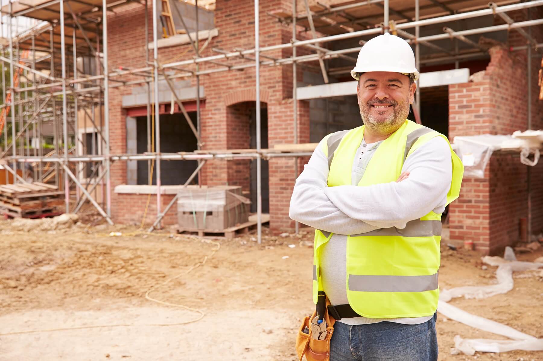 Tradesman setting out structural work before the build begins