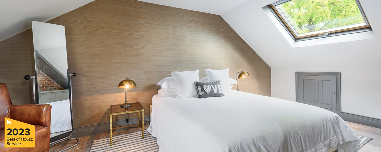 Loft conversion finished as a guest bedroom with rooflights