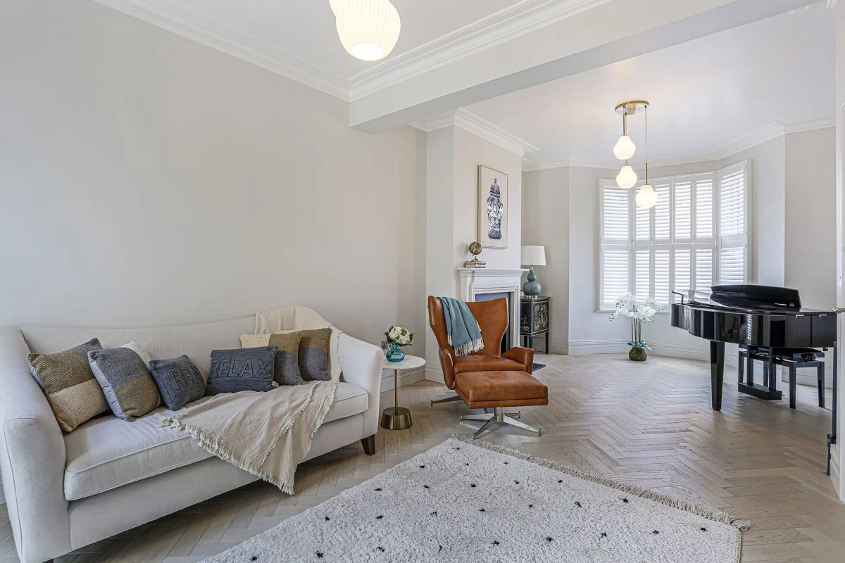 A converted basement living space by AXE Construction across South West London