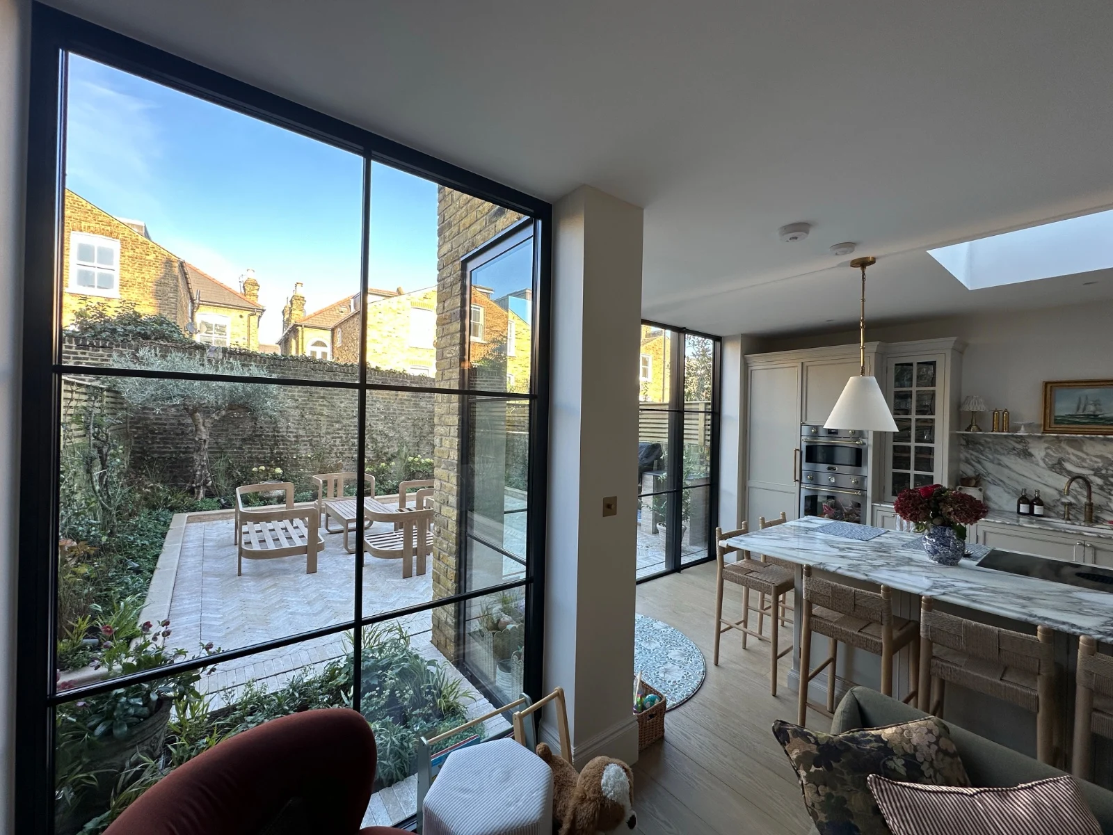 Interior of a large open-plan extension — the kind of space a wrap-around delivers when both the side return and rear projection are combined.
