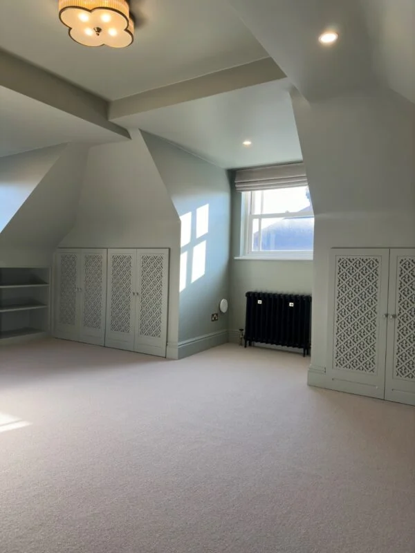 A finished loft master bedroom — the kind of usable space a £55K–£75K dormer conversion delivers.