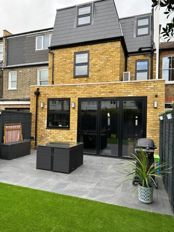 A rear dormer loft conversion above a single-storey rear extension — a common whole-house remodel pattern in South London.